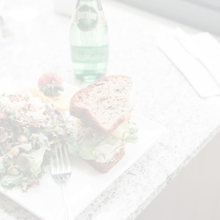 Café lunch featuring a half sandwich and fresh side salad available for online order from Lilac Pâtisserie.