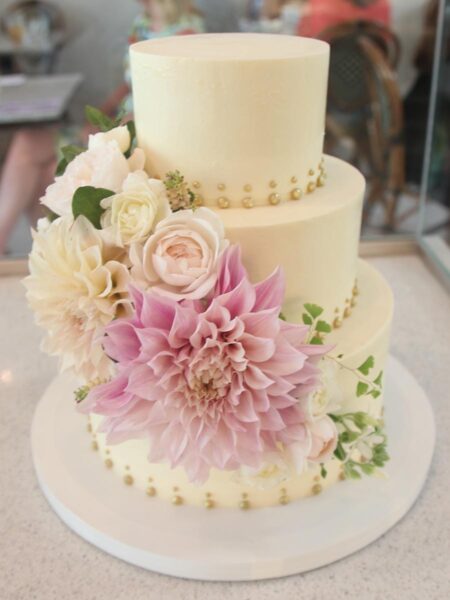 Cascading Flower And Gold Dot Wedding Cake