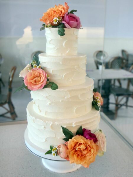Rustic Textured Wedding Cake With Bright Flowers