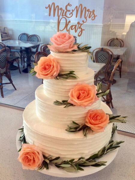 Sherbet Rose And Olive Branch Wedding Cake With Butterknife Swirl